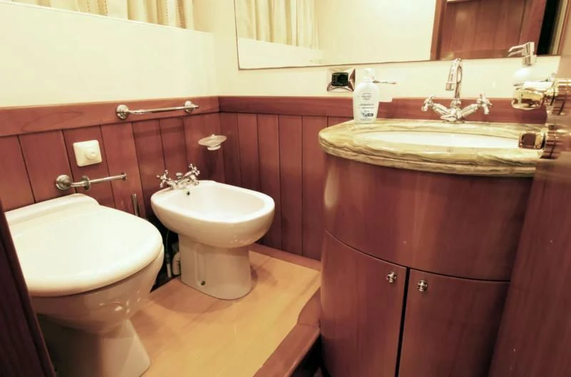 a bathroom with a sink and a toilet aboard TOI MOI ET ROBY Yacht for Sale