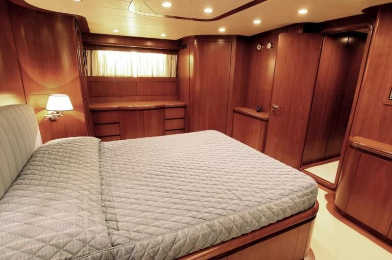a bed in a room aboard TOI MOI ET ROBY Yacht for Sale