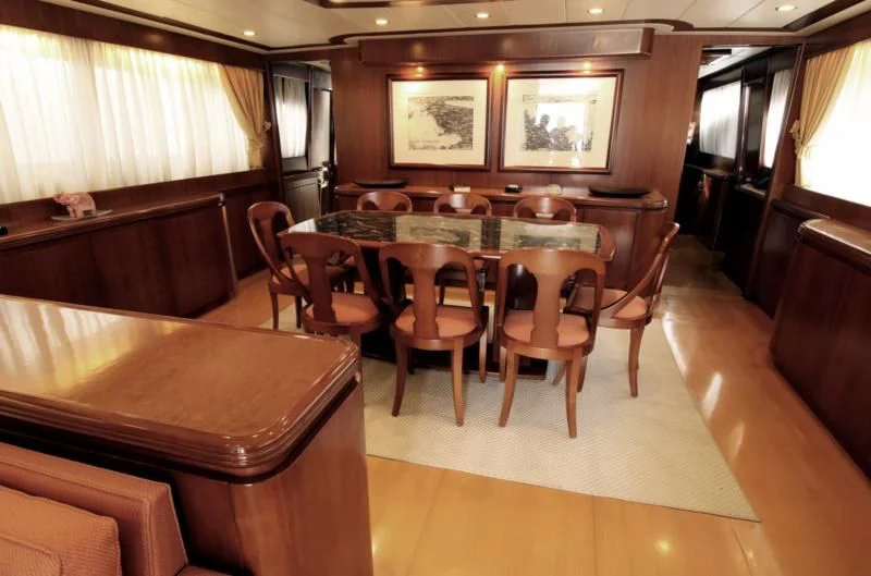 a room with a table and chairs aboard TOI MOI ET ROBY Yacht for Sale