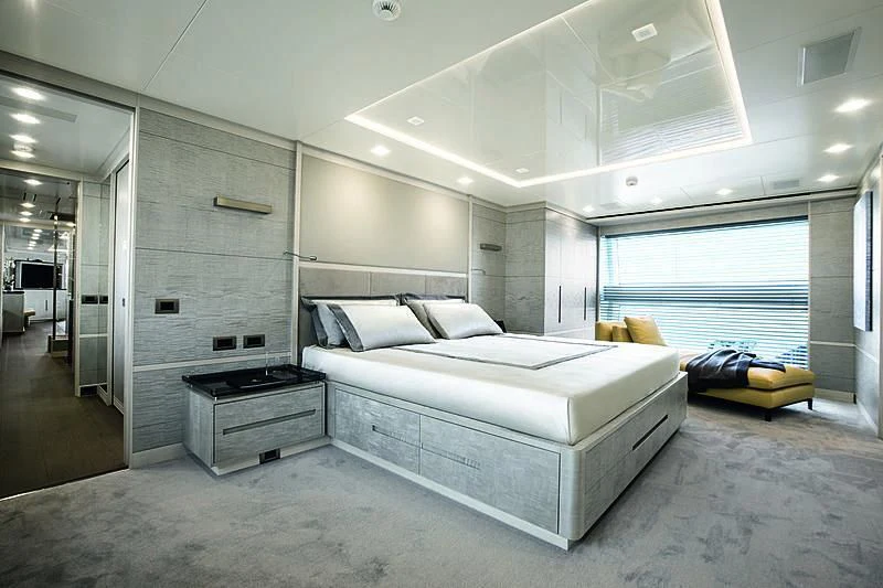 a large white bedroom with a large window aboard DELIBERATELY LUCKY Yacht for Sale