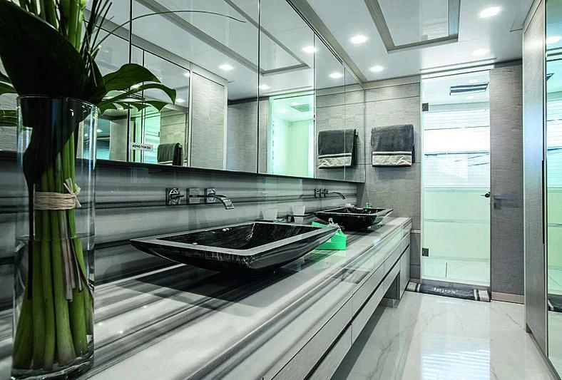 a large bathroom with a large marble countertop aboard DELIBERATELY LUCKY Yacht for Sale