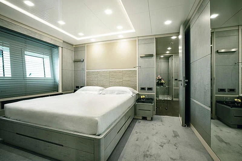 a large bathroom with a bed aboard DELIBERATELY LUCKY Yacht for Sale
