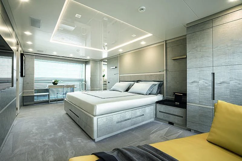 a large bedroom with a large window aboard DELIBERATELY LUCKY Yacht for Sale
