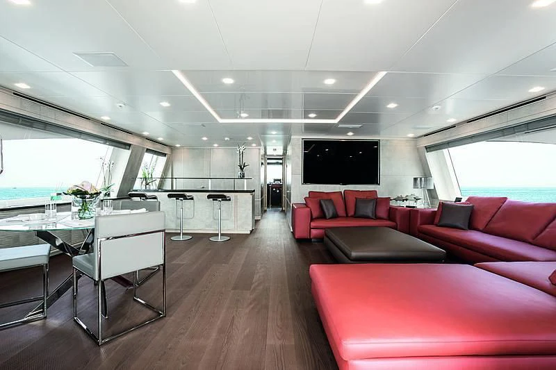 a large room with a table and chairs aboard DELIBERATELY LUCKY Yacht for Sale