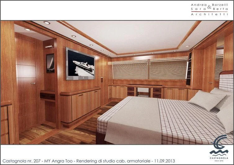 a room with a bed and a wood door aboard ANGRA TOO Yacht for Sale