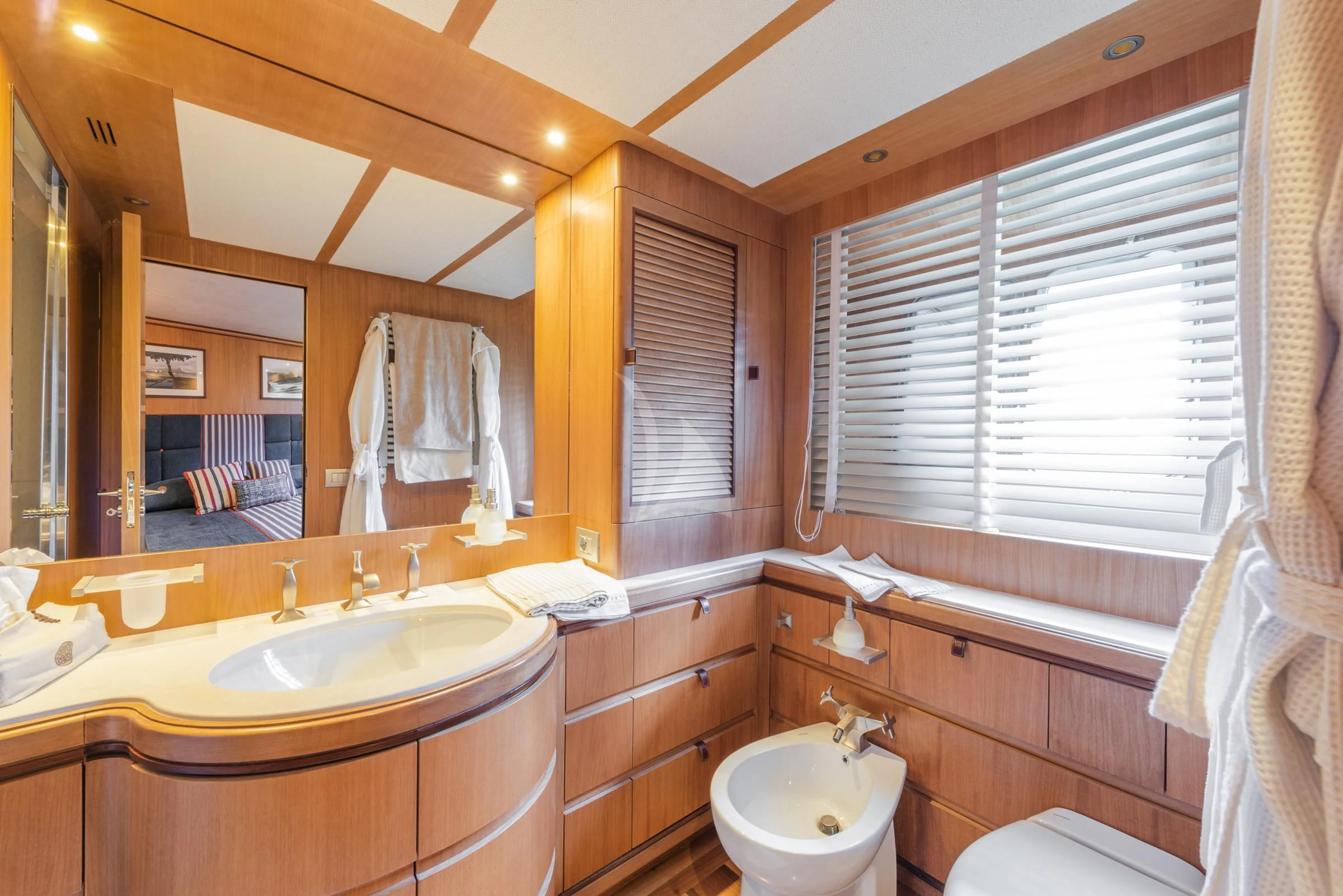 a bathroom with a large mirror aboard ANGRA TOO Yacht for Sale