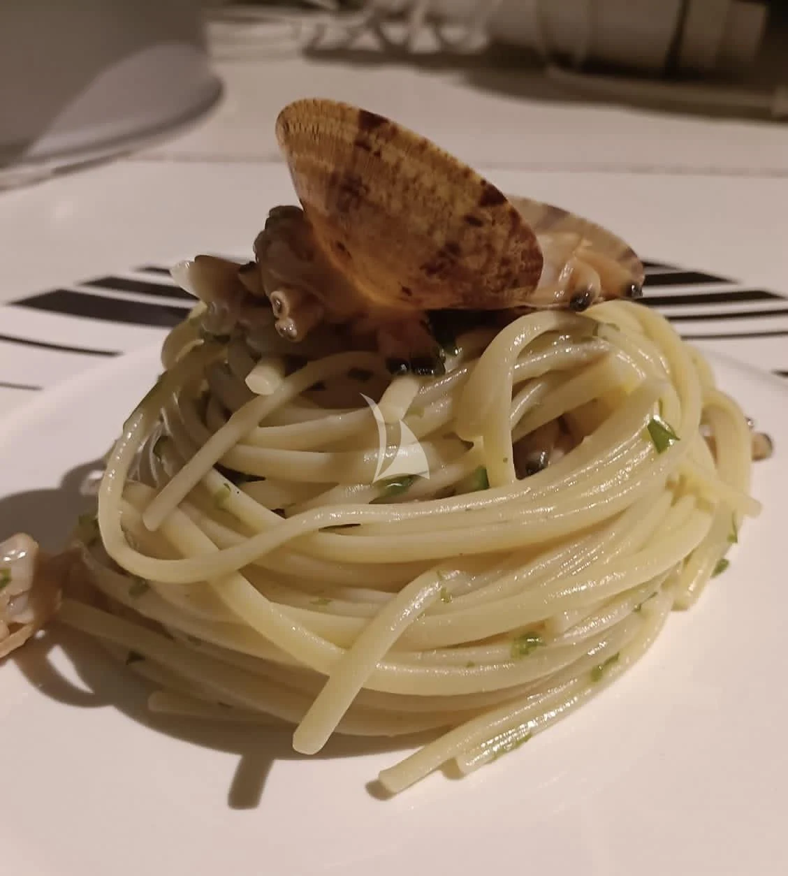 a plate of spaghetti and a slice of bread aboard ANGRA TOO Yacht for Sale