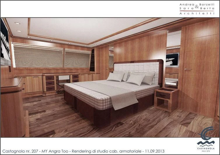 a room with a bed and a desk aboard ANGRA TOO Yacht for Sale