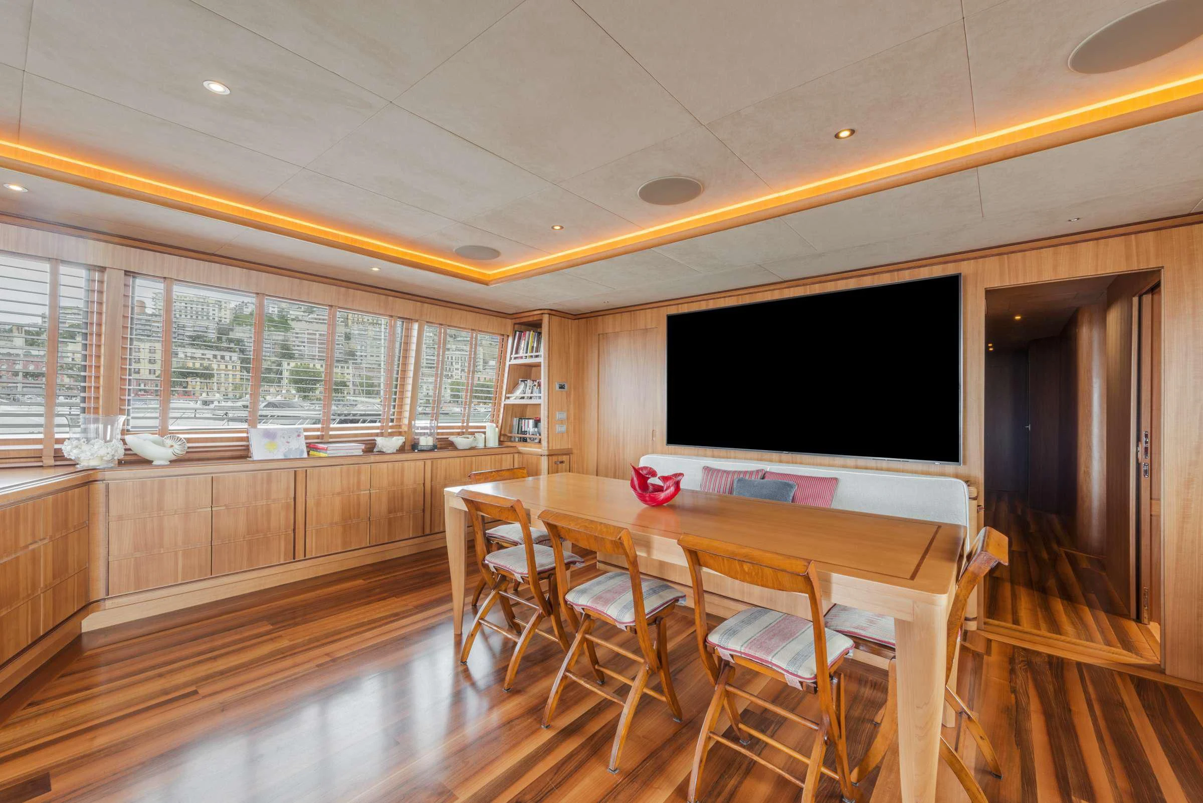 a large room with a table and chairs aboard ANGRA TOO Yacht for Sale