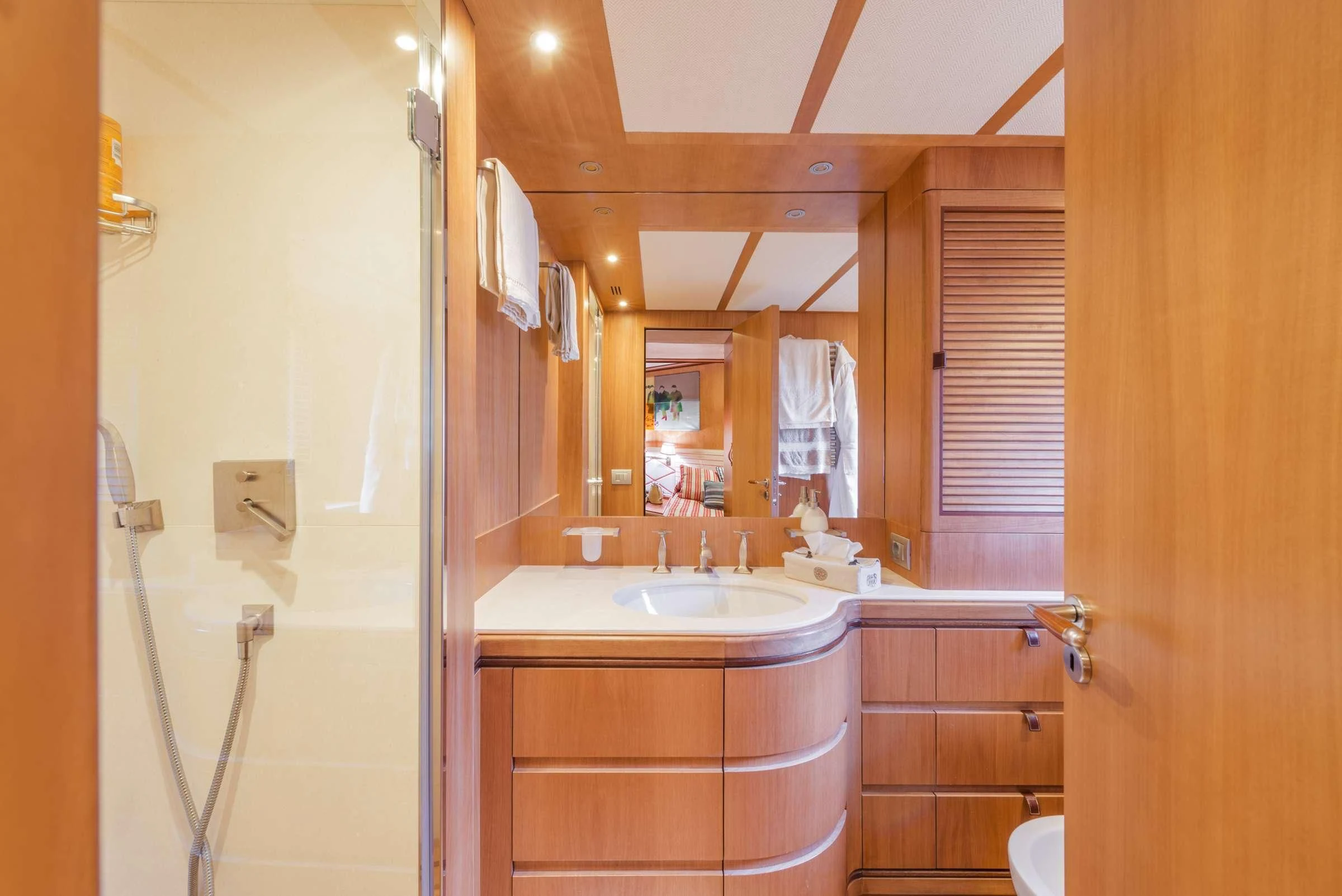 a bathroom with a shower and sink aboard ANGRA TOO Yacht for Sale