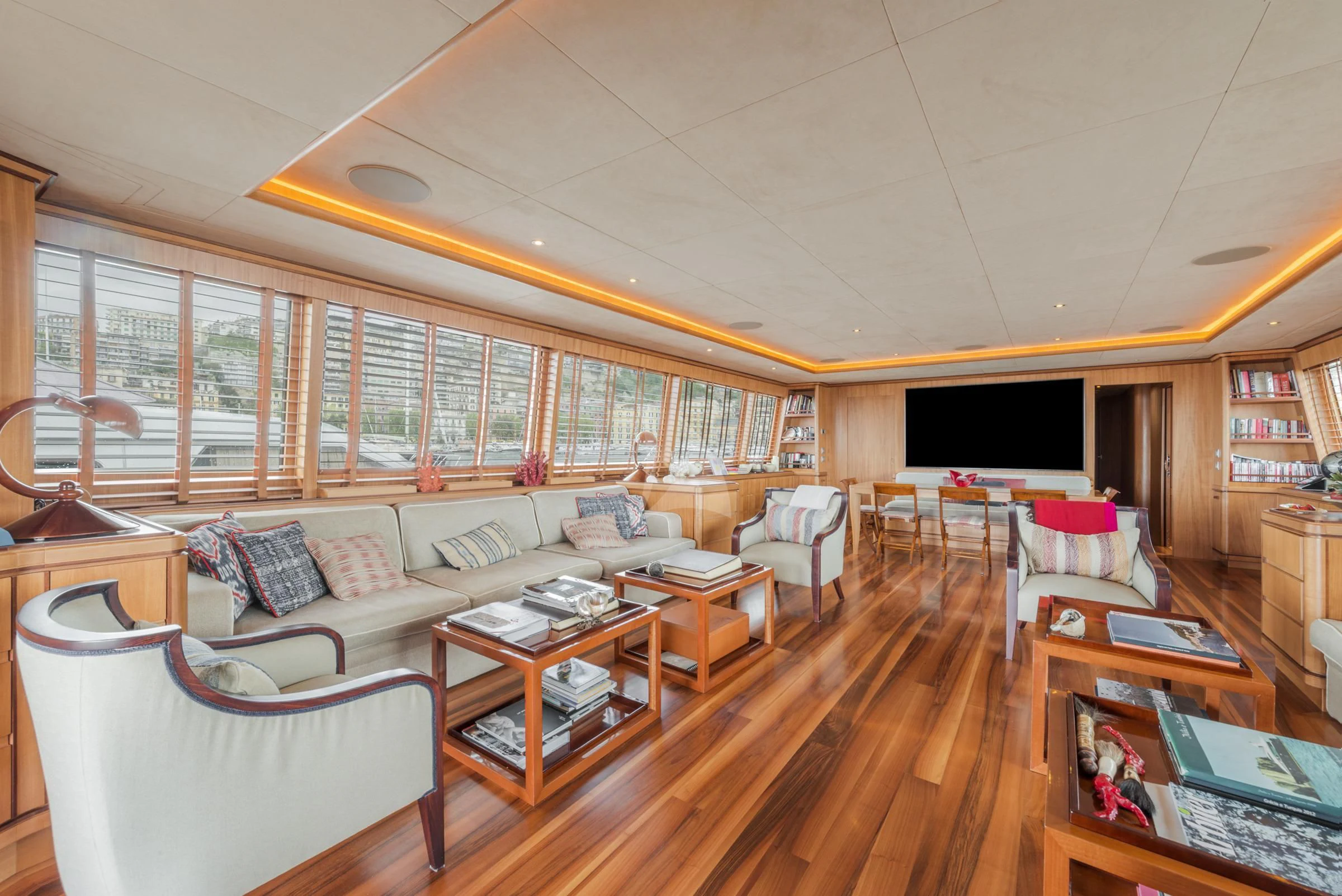 a living room with a large window aboard ANGRA TOO Yacht for Sale