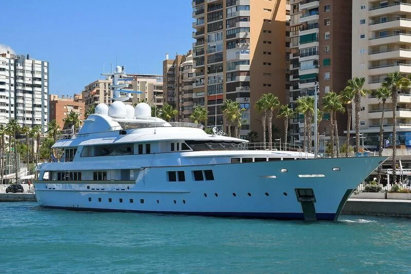 a large white boat in a city aboard JAMAICA BAY Yacht for Sale