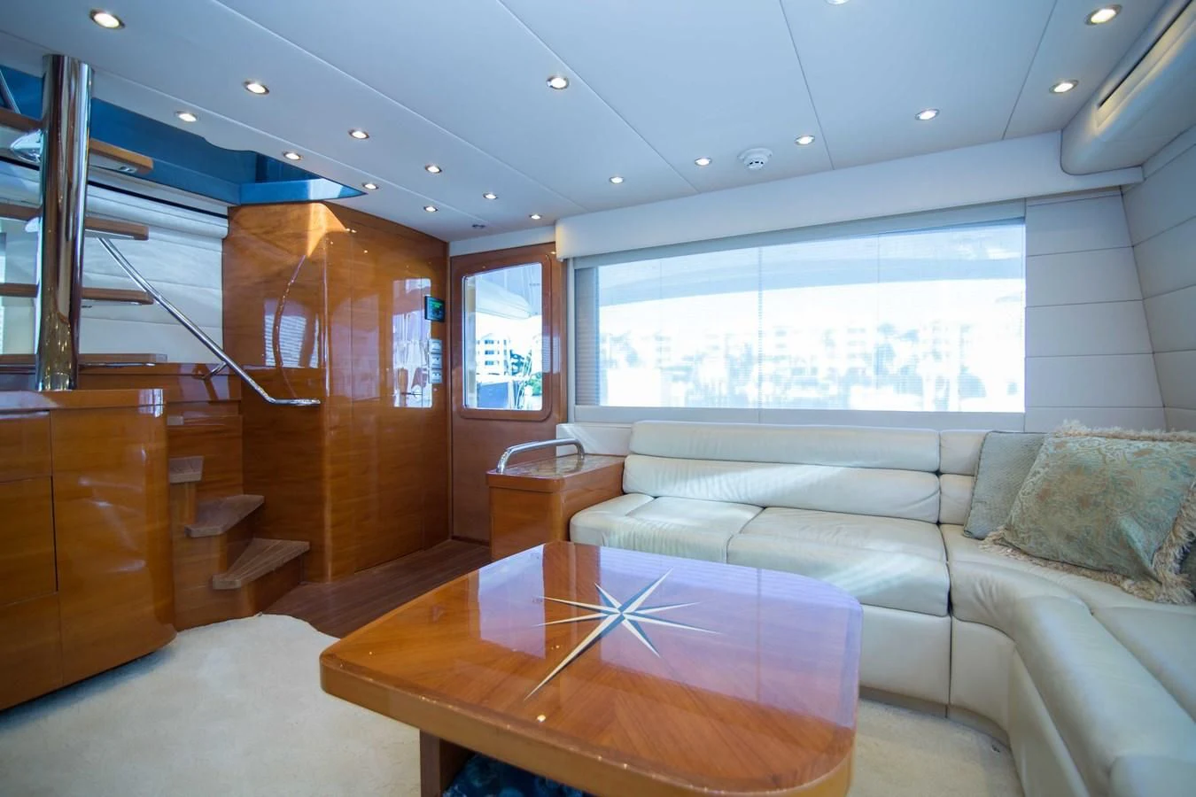 a living room with a large window aboard PREDATOR Yacht for Sale