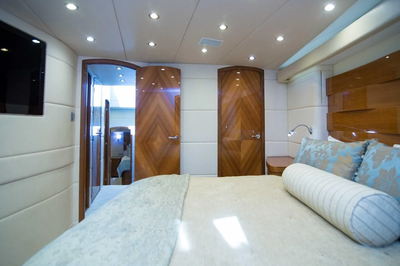 a bed with white sheets aboard PREDATOR Yacht for Sale
