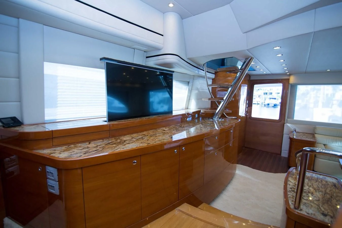 a room with a tv and cabinets aboard PREDATOR Yacht for Sale
