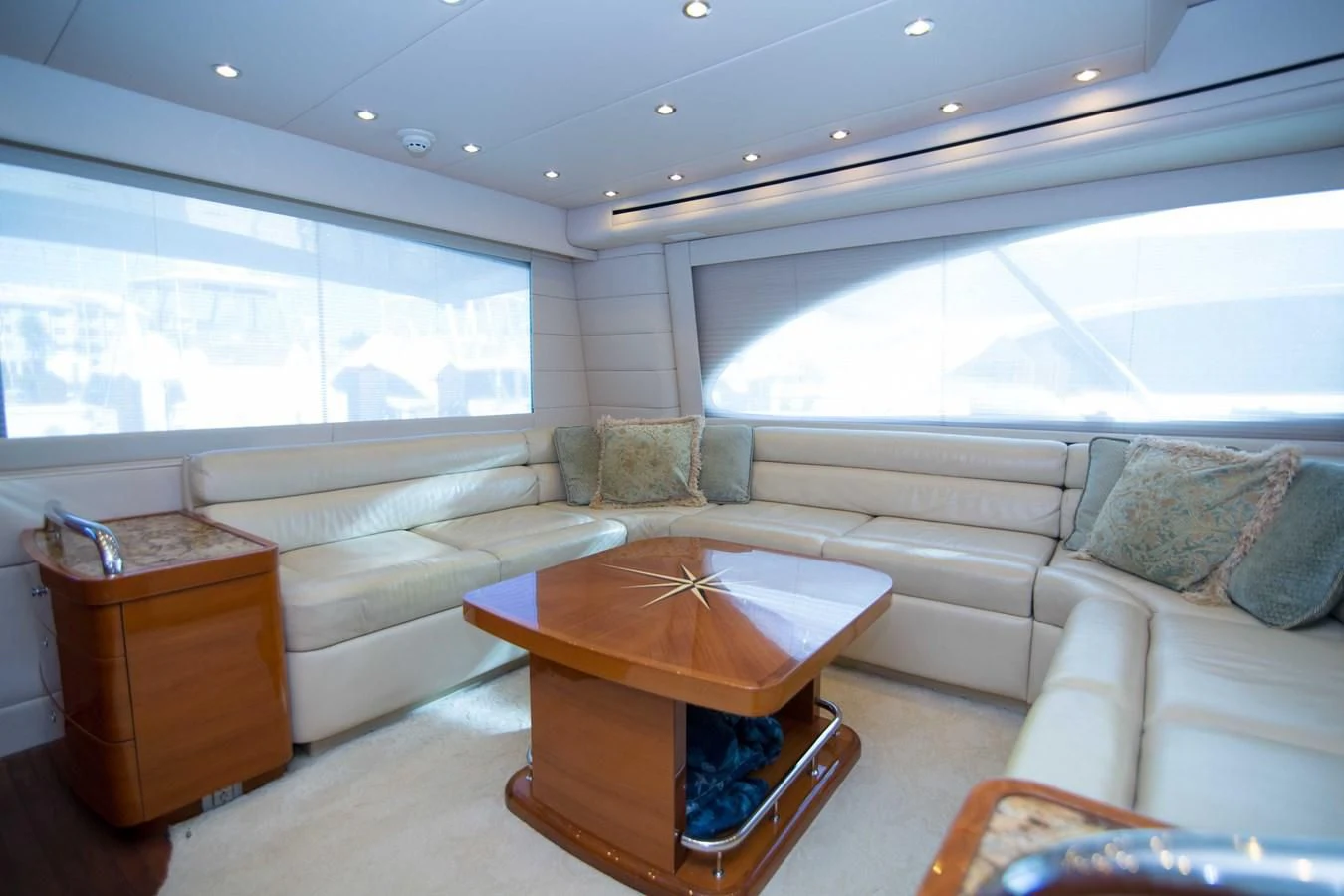 a living room with a couch and a coffee table aboard PREDATOR Yacht for Sale