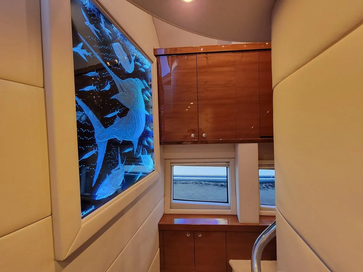 a window with a painting on it aboard PREDATOR Yacht for Sale