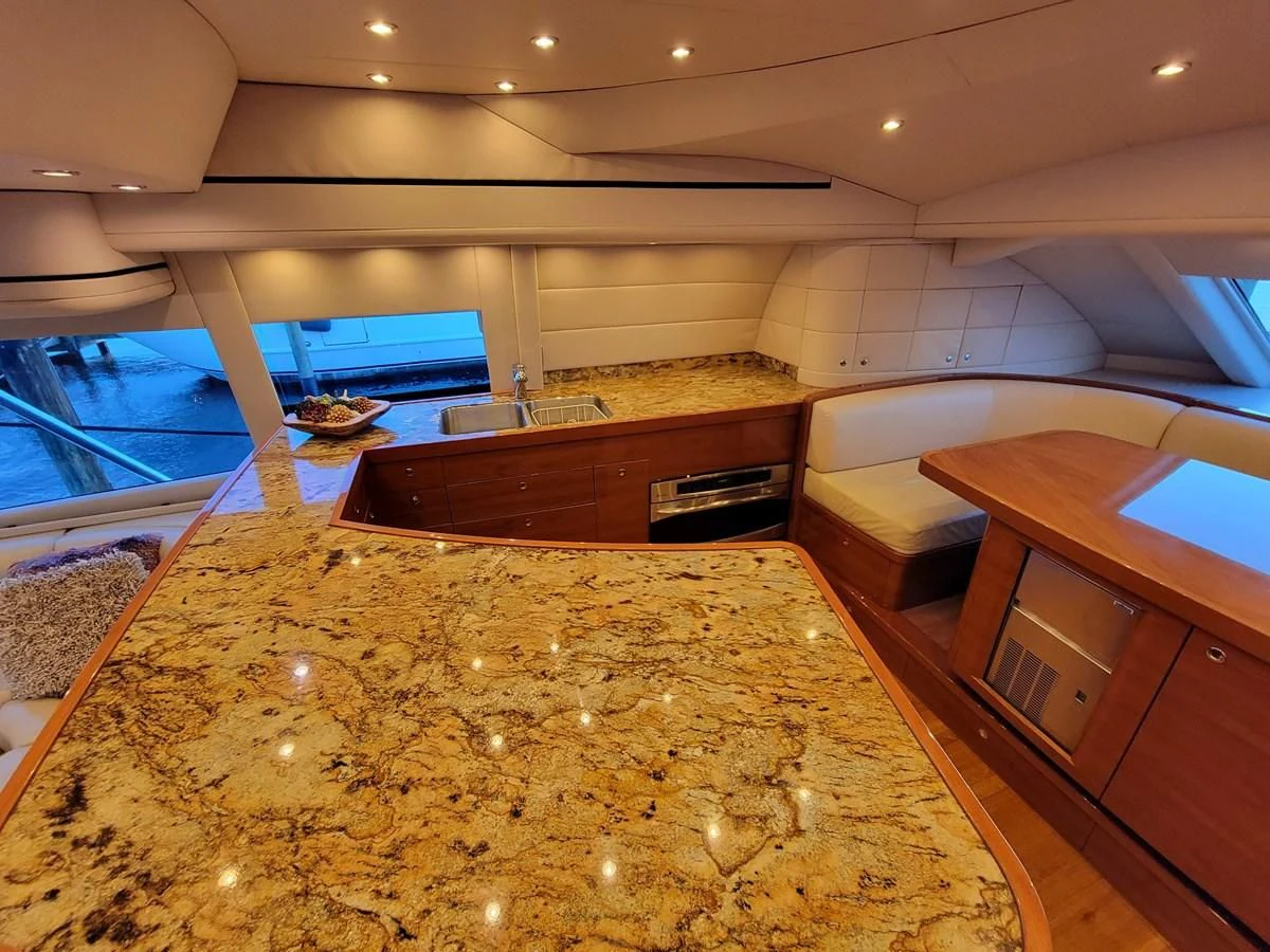 a room with a large jacuzzi tub and a large rug aboard PREDATOR Yacht for Sale