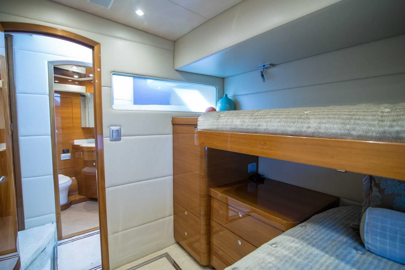 a room with a bed and a closet aboard PREDATOR Yacht for Sale