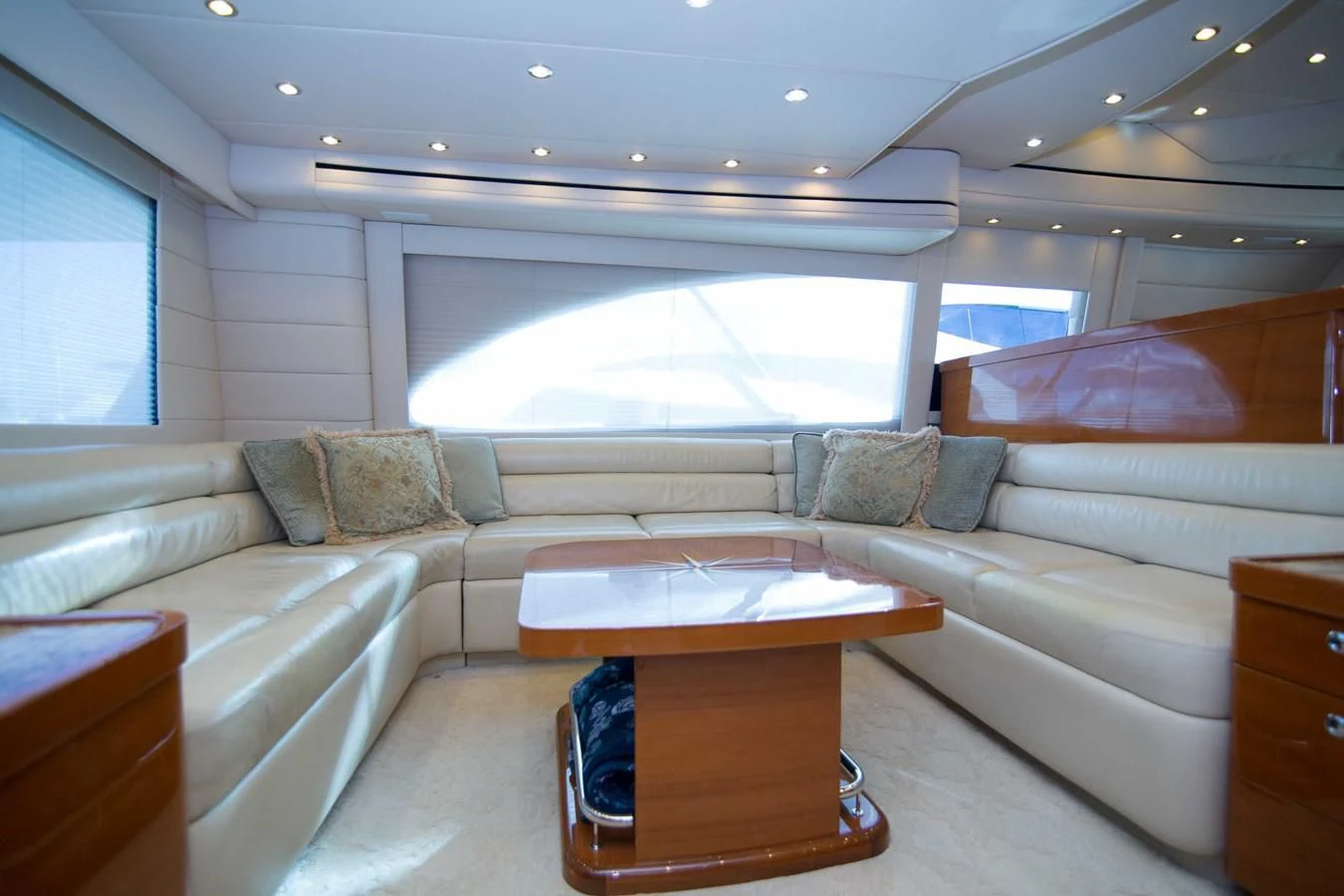 a living room with a couch and a coffee table aboard PREDATOR Yacht for Sale