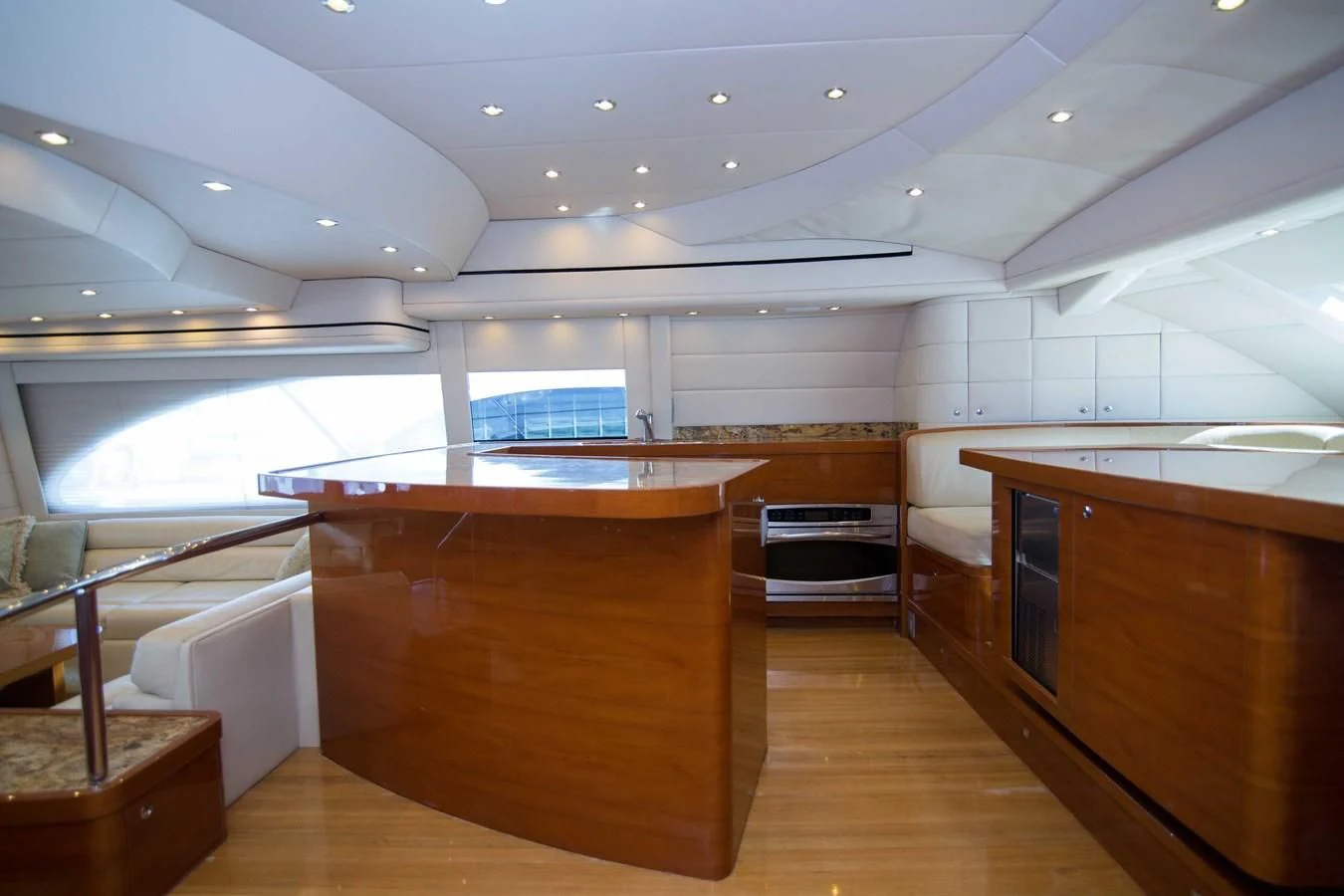 a room with a wood floor and a large window aboard PREDATOR Yacht for Sale