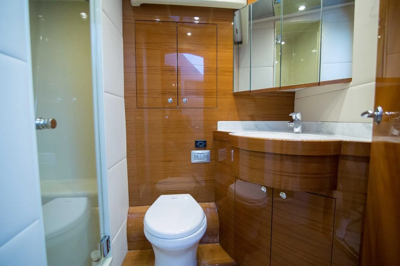 a bathroom with a toilet and sink aboard PREDATOR Yacht for Sale