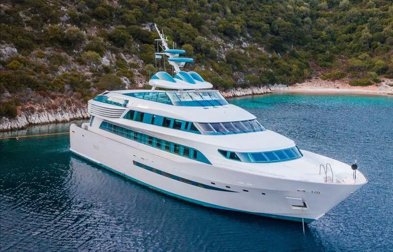 a white boat on water aboard ALAMSHAR Yacht for Sale