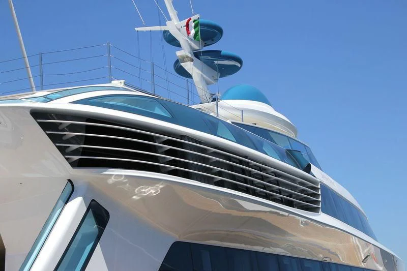 a white boat with a satellite dish on the roof aboard ALAMSHAR Yacht for Sale