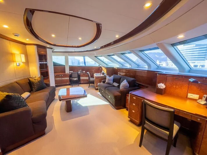a large room with a couch and a table aboard ALAMSHAR Yacht for Sale