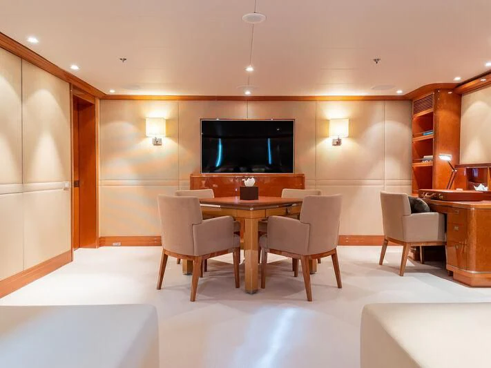 a room with a table and chairs aboard ALAMSHAR Yacht for Sale