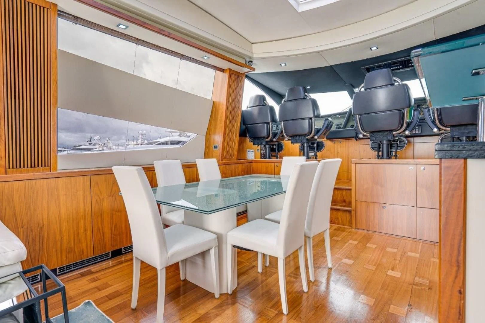 a room with a table and chairs aboard SKY FALL Yacht for Sale