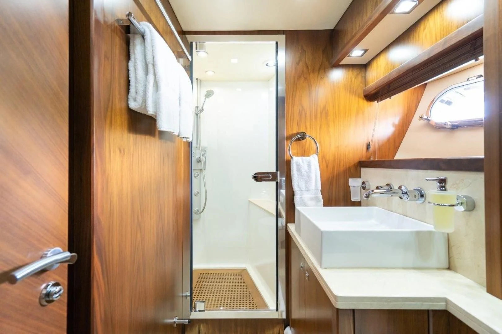 a bathroom with a sink and a mirror aboard SKY FALL Yacht for Sale