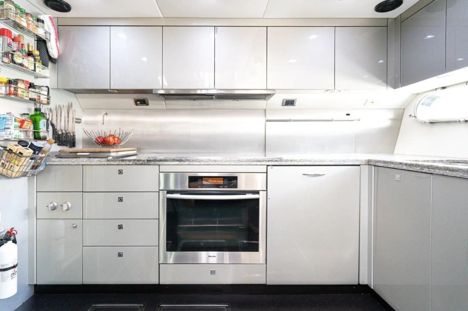 a kitchen with white cabinets aboard SKY FALL Yacht for Sale