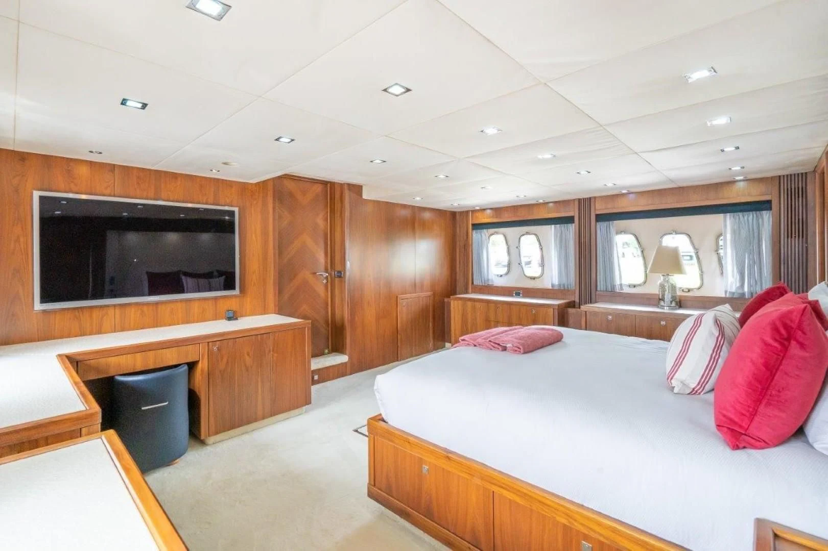 a bedroom with a bed and tv aboard SKY FALL Yacht for Sale