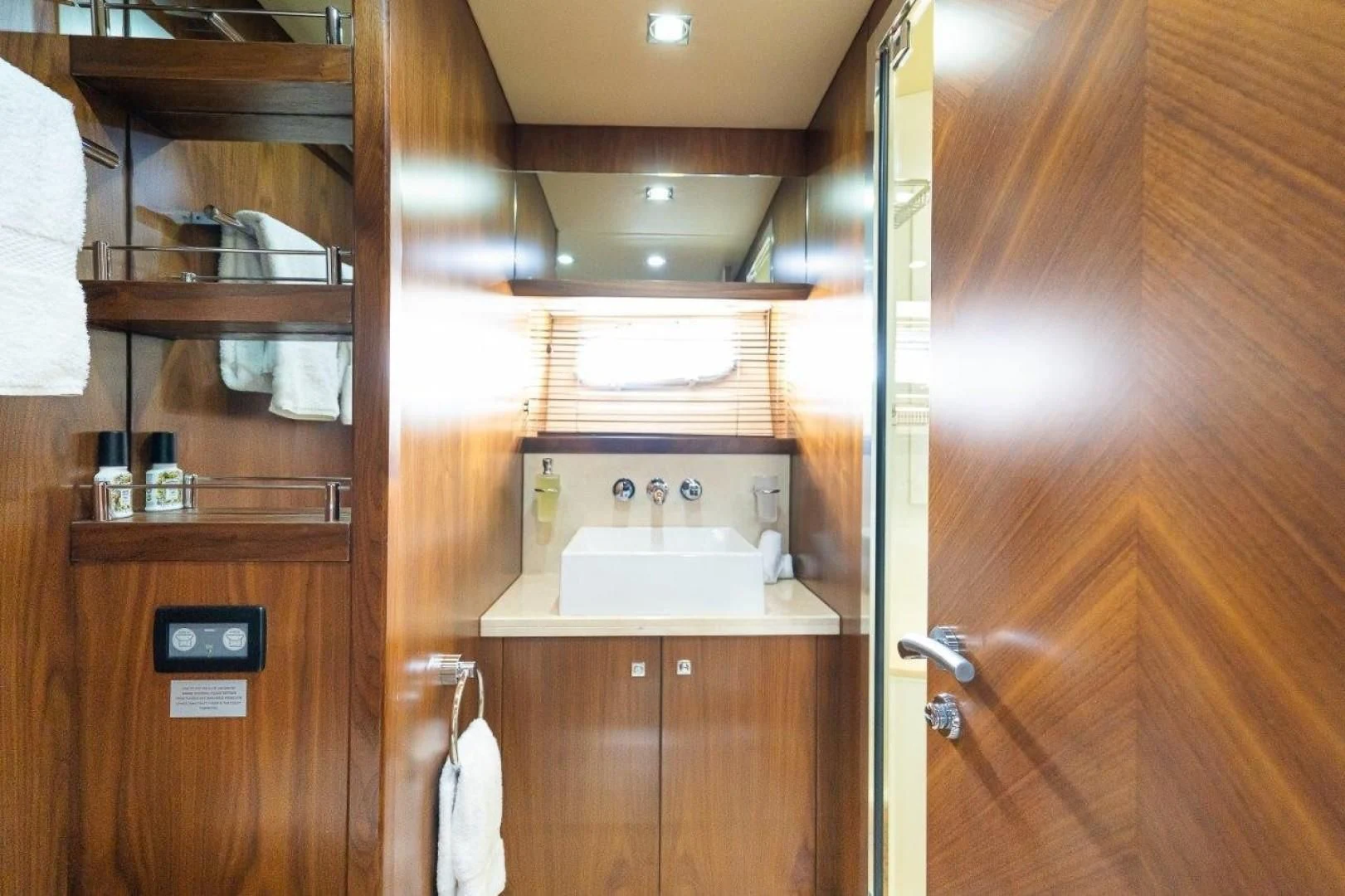 a bathroom with a sink and a mirror aboard SKY FALL Yacht for Sale