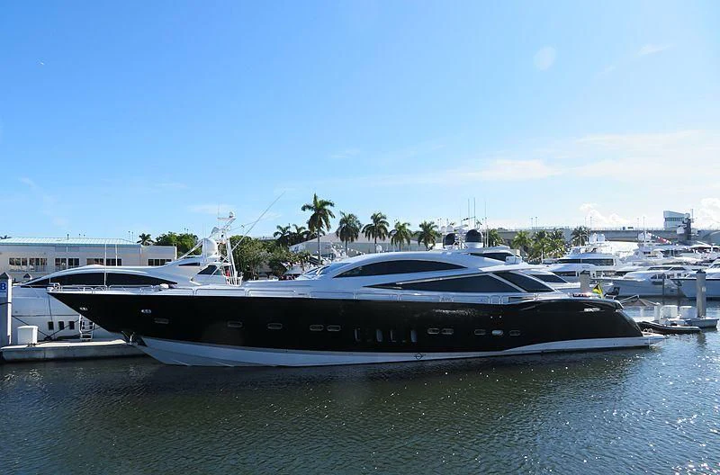 a large yacht in a harbor aboard SKY FALL Yacht for Sale