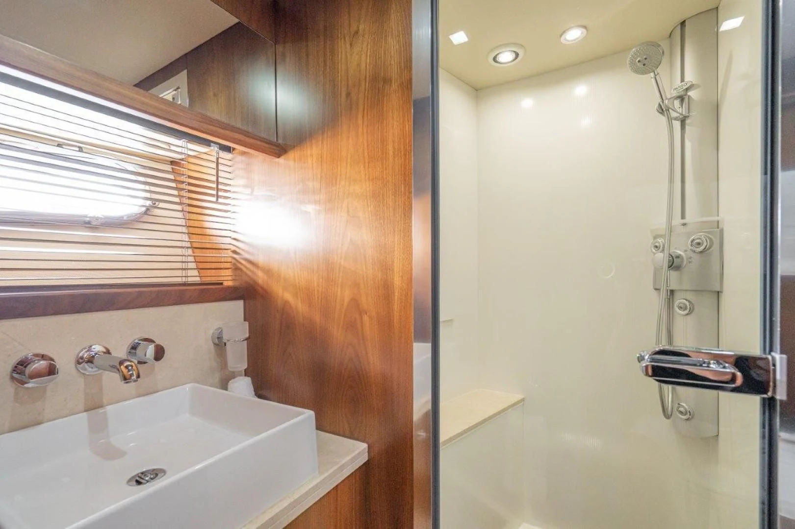 a bathroom with a sink and a shower aboard SKY FALL Yacht for Sale