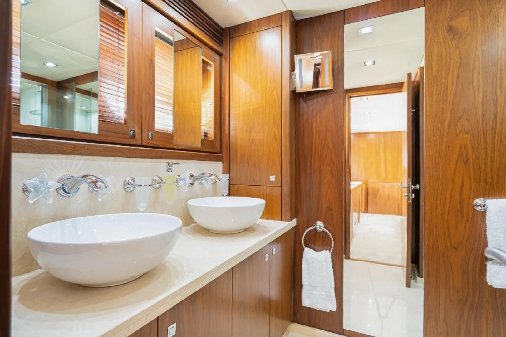 a bathroom with a sink and a mirror aboard SKY FALL Yacht for Sale