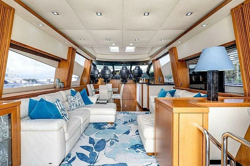 a room with a couch and a table aboard SKY FALL Yacht for Sale