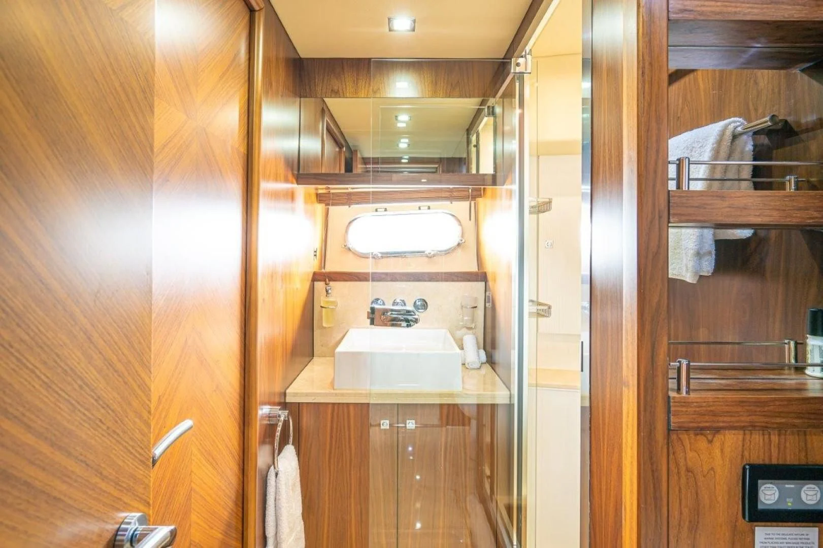 a bathroom with a sink and a mirror aboard SKY FALL Yacht for Sale