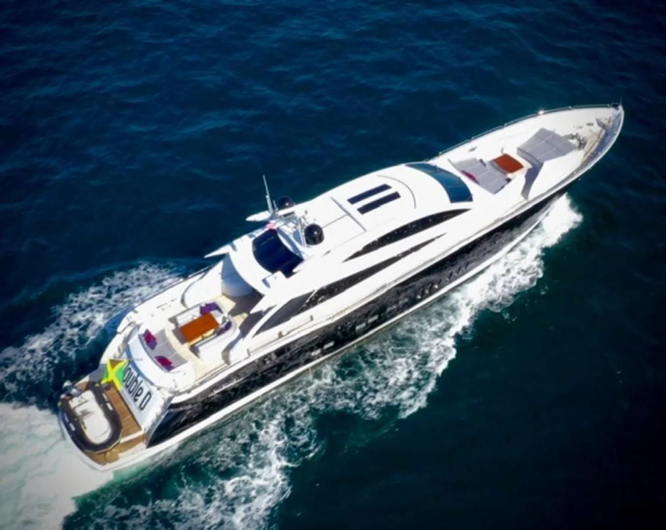 a white boat on the water aboard SKY FALL Yacht for Sale