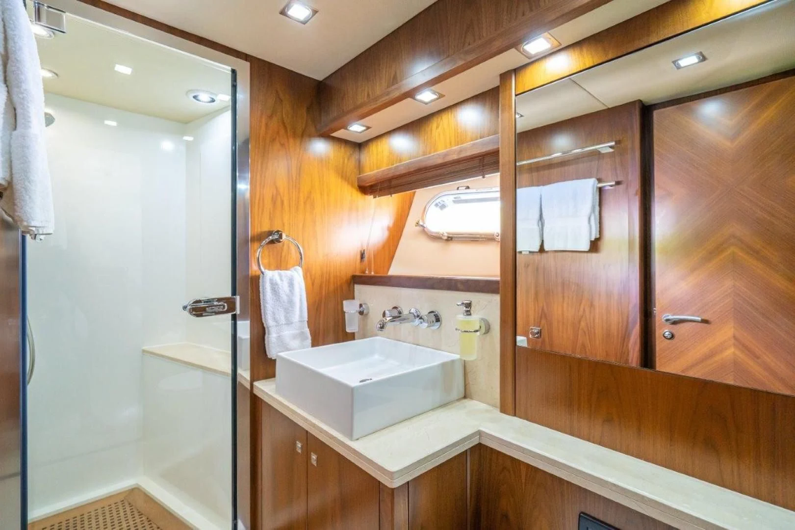 a bathroom with a sink and a mirror aboard SKY FALL Yacht for Sale