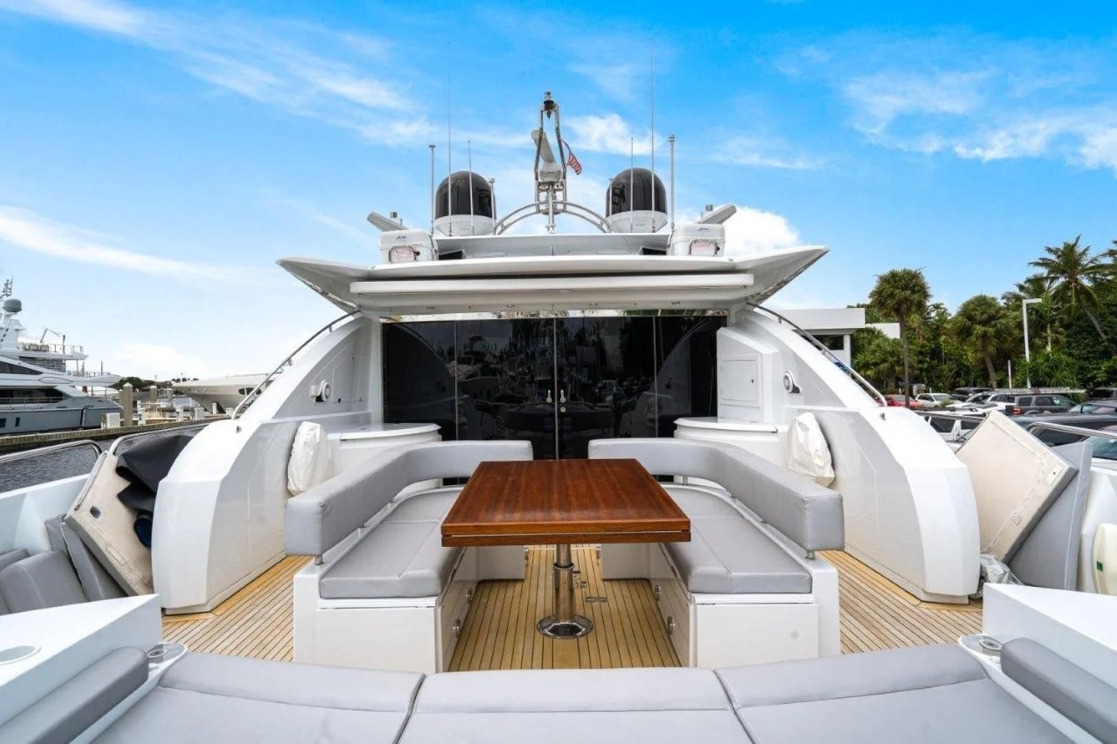 a boat with a deck and a bench in front of it aboard SKY FALL Yacht for Sale