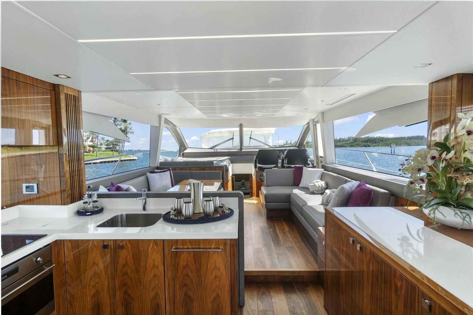 a kitchen with a sink and a couch aboard EXIT Yacht for Sale