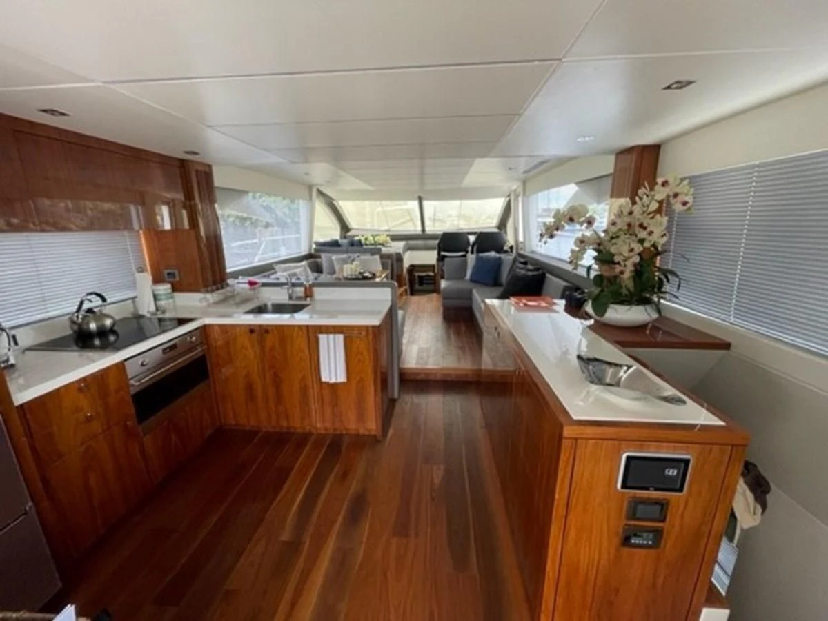 a kitchen with a wood floor aboard EXIT Yacht for Sale