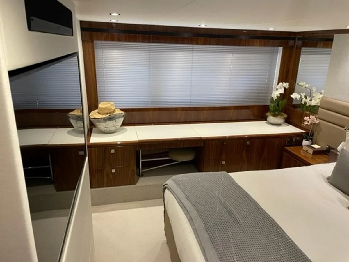 a room with a bed and a desk aboard EXIT Yacht for Sale