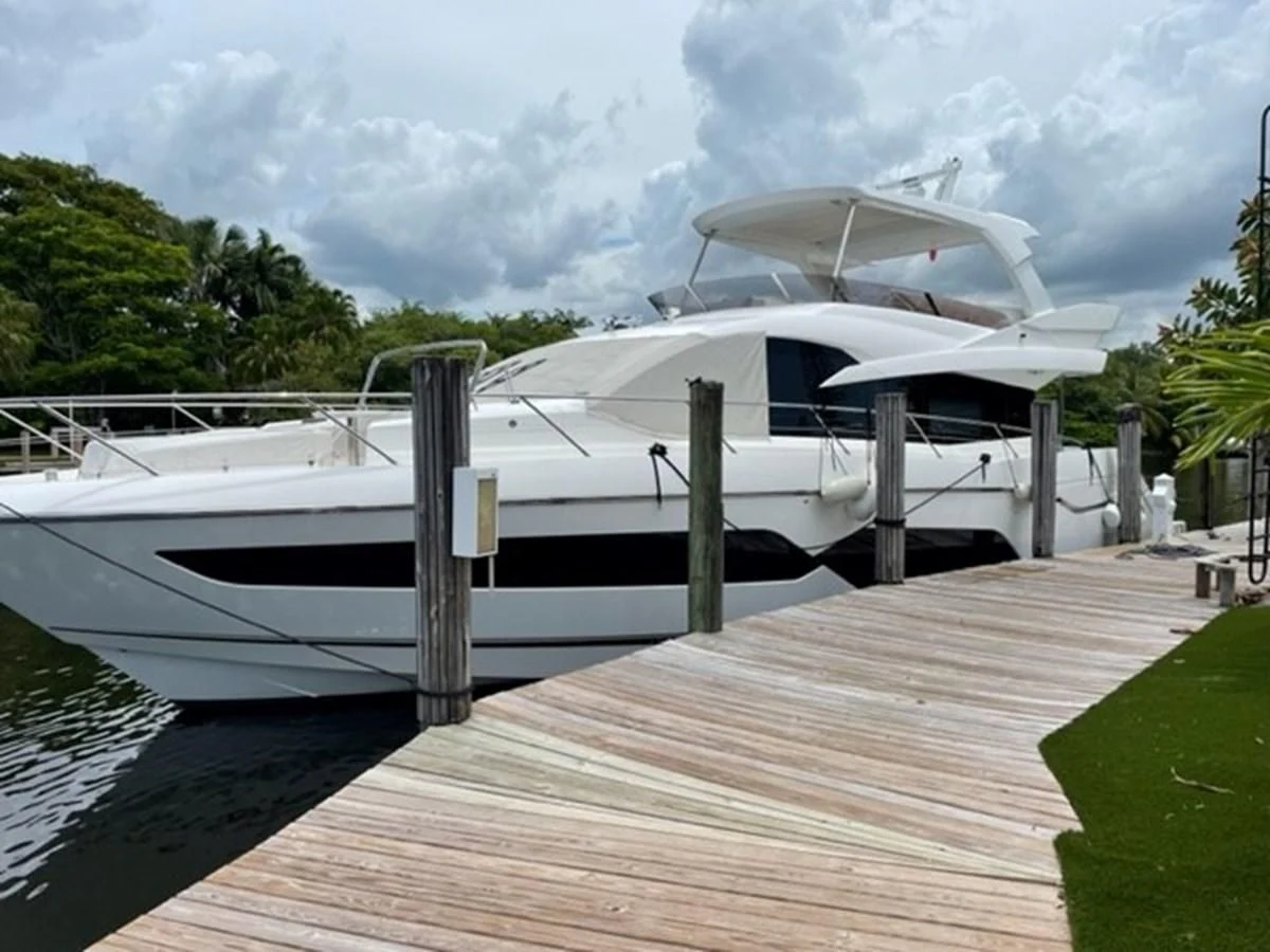 a boat docked at a pier aboard EXIT Yacht for Sale