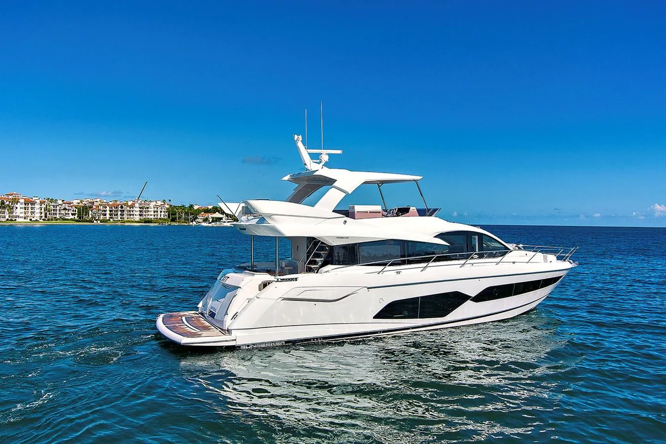 a white yacht in the water aboard EXIT Yacht for Sale