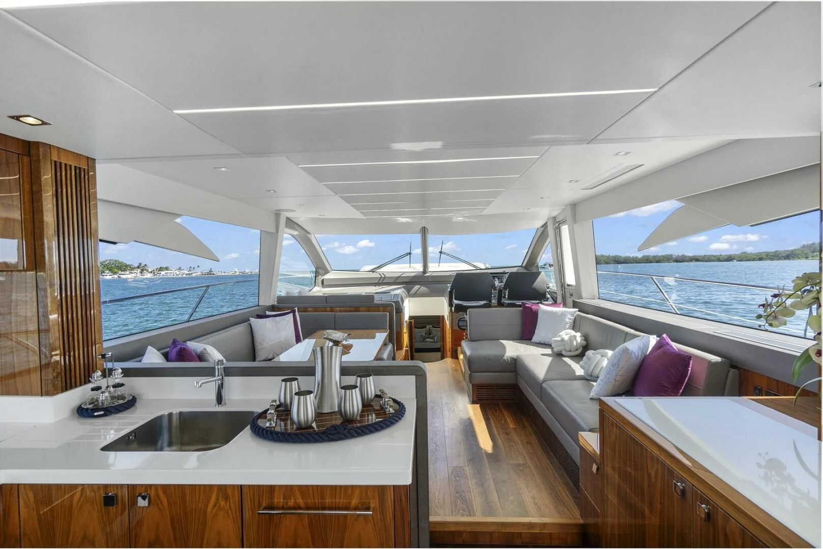 a large living room with a view of the ocean aboard EXIT Yacht for Sale