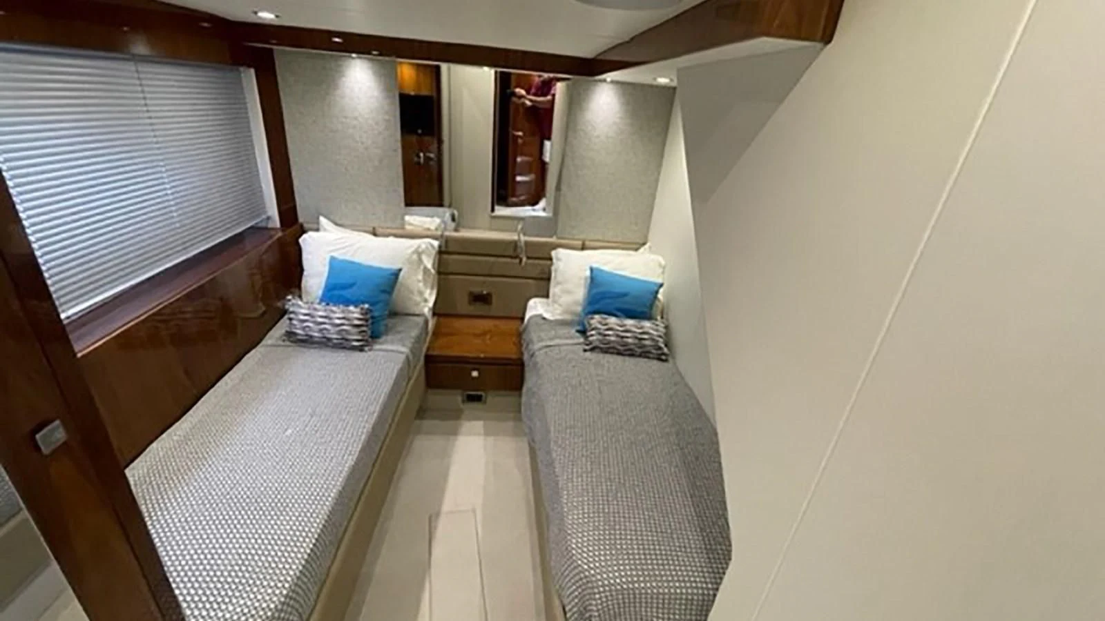 a room with a bed and a window aboard EXIT Yacht for Sale